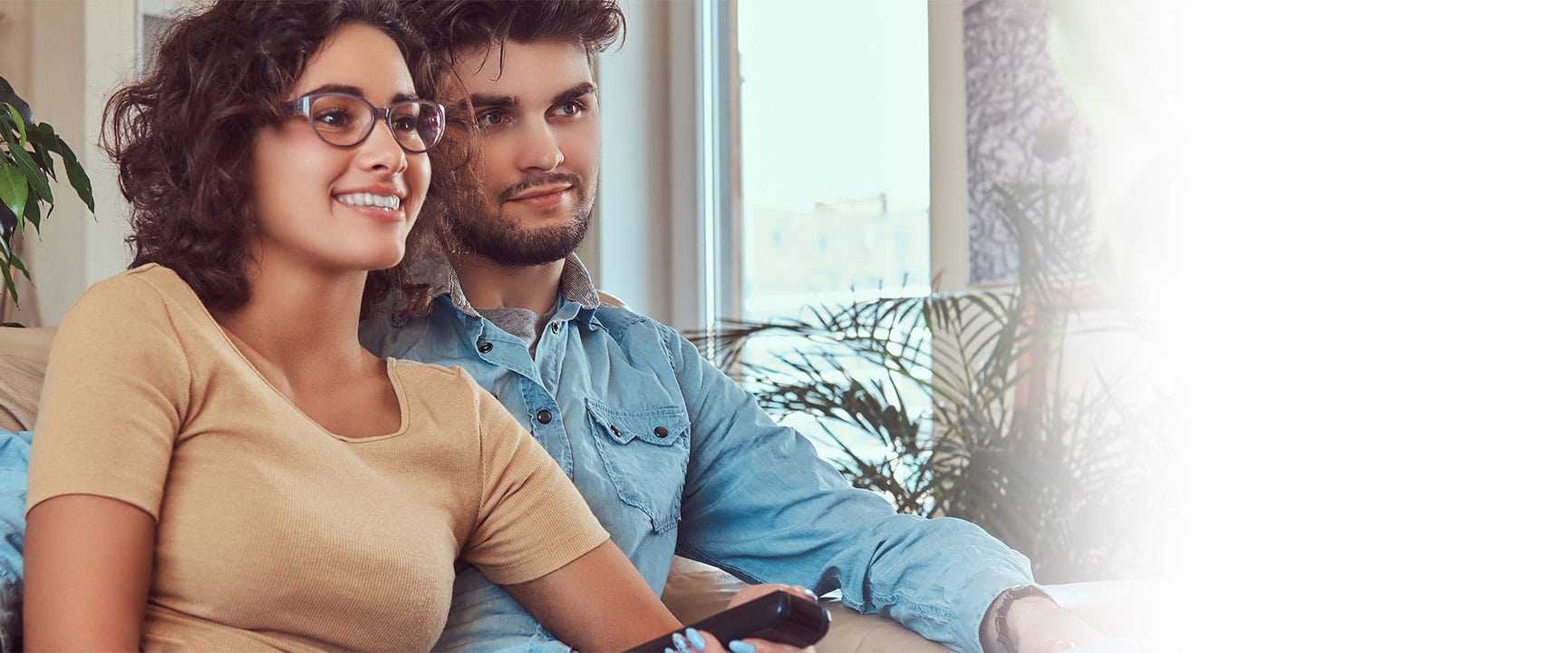 happy couple watching tv