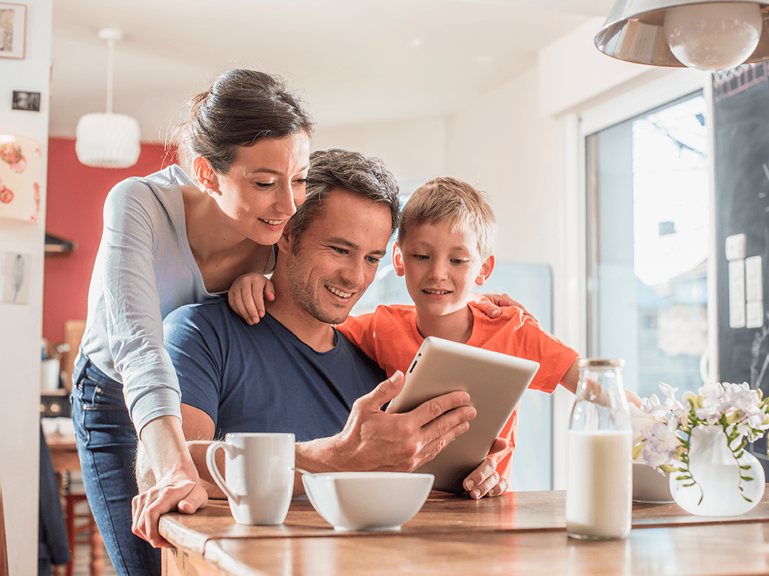 Family on tablet in kitchen